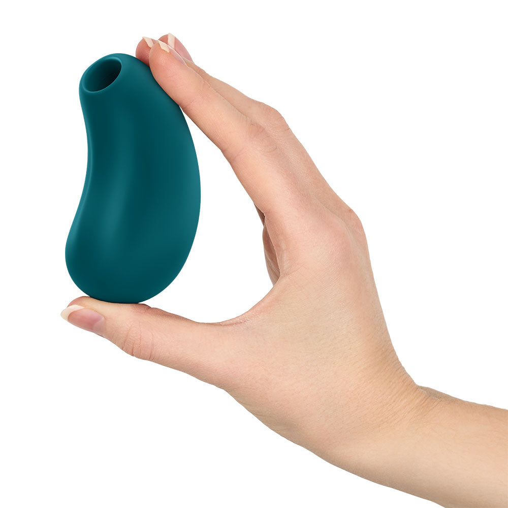 Fun Factory CHERIE Bottle  - Bottle  USB Rechargeable Air Pulse Stimulator held in hand, showcasing its sleek design.