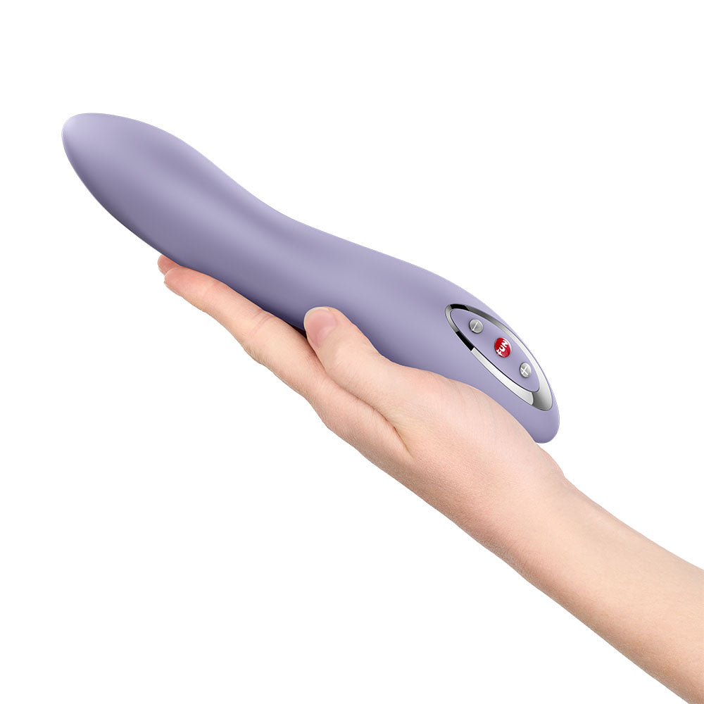Fun Factory STRONIC FLOW Light Violet - Light Violet 21.6 cm USB Rechargeable Thrusting Vibrator held in hand.