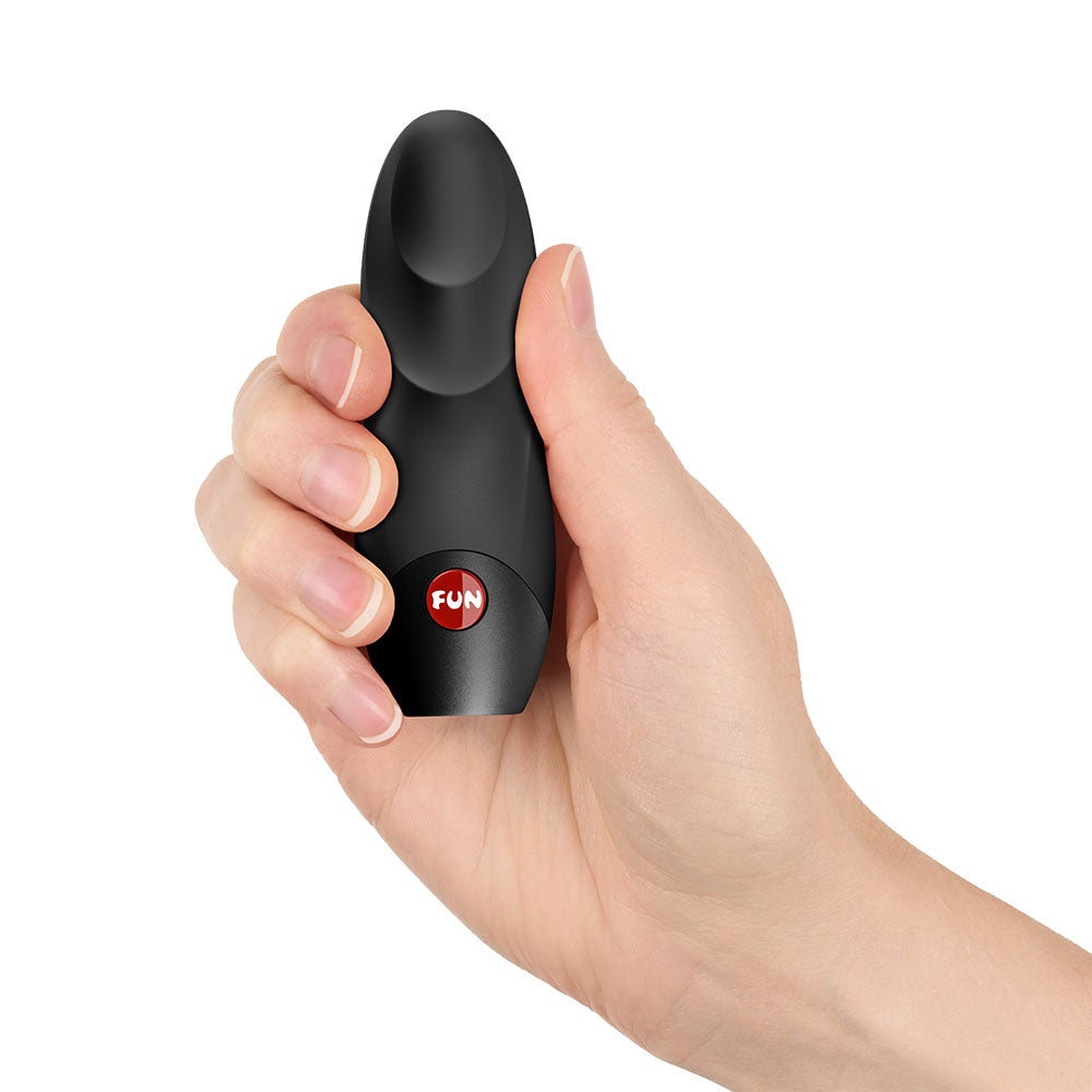 Hand holding the Fun Factory VIOLA - Vibrating Bullet, showcasing its sleek and compact design for intimate essentials.