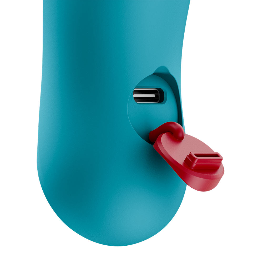 Fun Factory BIJOU Aquamarine - Aquamarine USB-C Rechargeable Stimulator port detail with red cover.