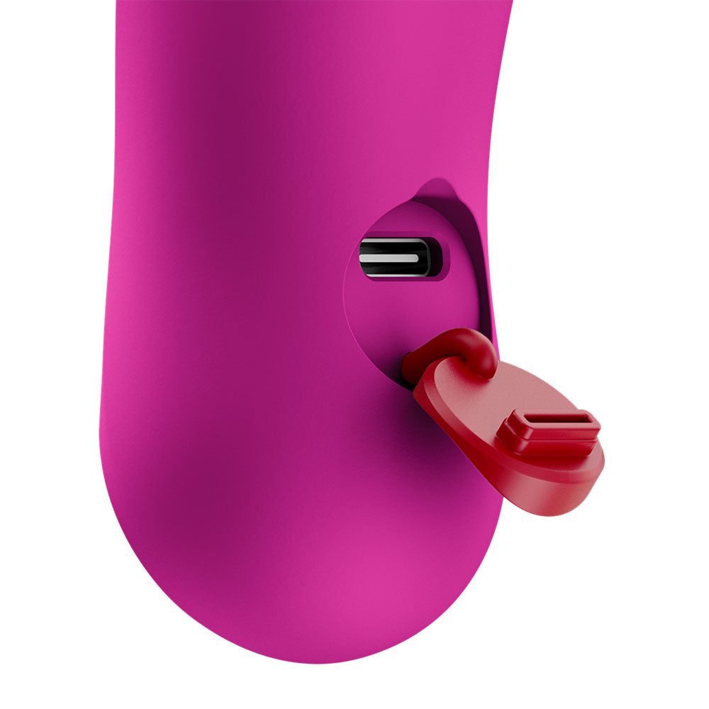 Fun Factory BIJOU Magenta - Magenta USB-C Rechargeable Stimulator showing charging port and silicone texture.