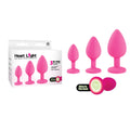 Heart Light -  -  Butt Plugs with Glow in Dark Bases - Set of 3 Sizes in pink silicone with glow-in-the-dark heart base