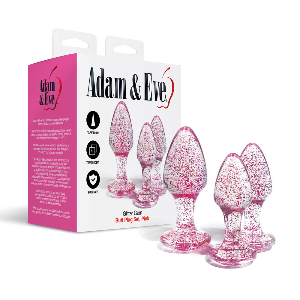 Adam & Eve Glitter Gem 3-Piece Butt Plug Set -  - Glitter  Butt Plugs - Set of 3 Sizes displayed with packaging in pink.