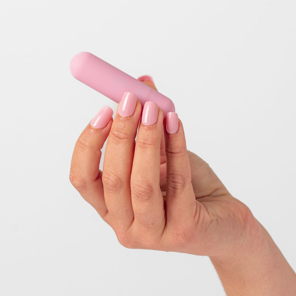 Girls Get Off - Polly - 6.3 cm USB Rechargeable Bullet in a hand, showcasing intimate essentials for her.