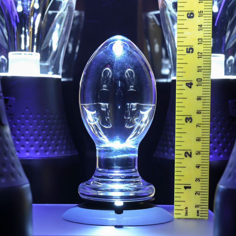 Gender X Crystal Ball -  Glass 13.6 cm Butt Plug with Suction Base displayed beside a ruler for size reference.