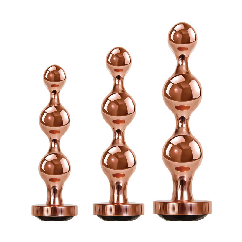 Gender X GOLD DIGGER SET -  Metallic Butt Plugs - Set of 3 Sizes in a sleek, shiny design for enhanced pleasure.