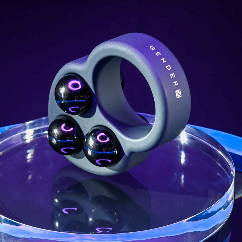 Gender X WORKOUT RING -  Weighted Cock Ring showcased with three removable weights, ideal for intimate essentials.