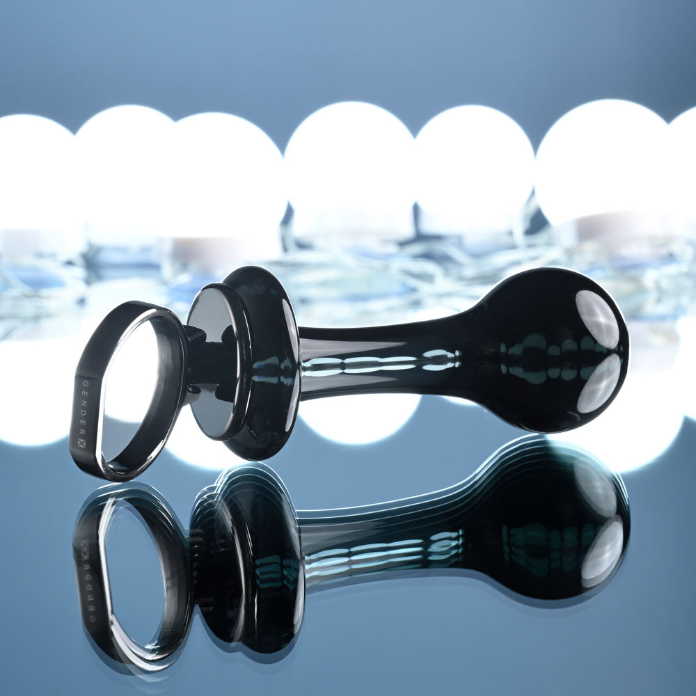 Gender X BLOW POP - 12.8 cm Glass Plug with Ring Pull on reflective surface against soft light