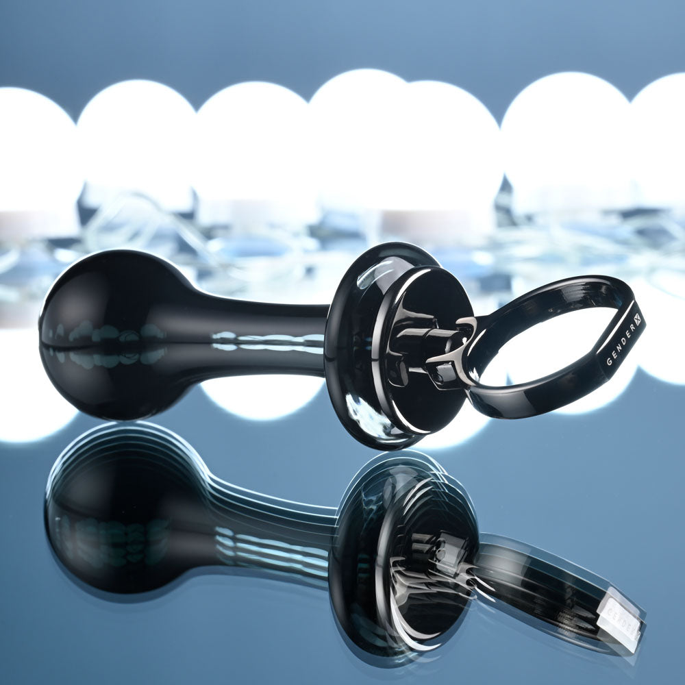 Gender X BLOW POP - 12.8 cm Glass Plug with Ring Pull reflecting on a smooth surface with illuminated background.