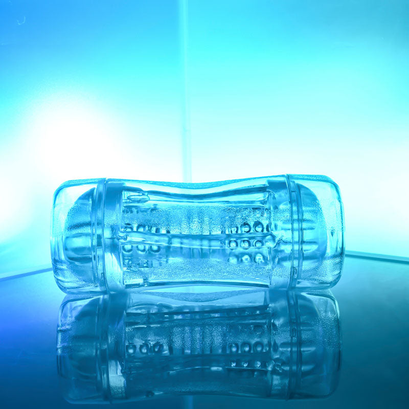 Gender X DOUBLE FANTASY double ended stroker on a reflective surface with blue lighting.