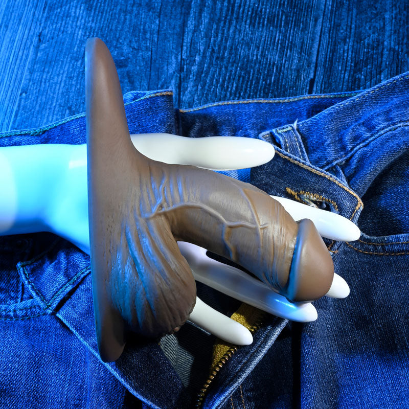 Gender X 4'' SILICONE PACKER DARK - 10 cm Packer with realistic texture and design on a background of denim.
