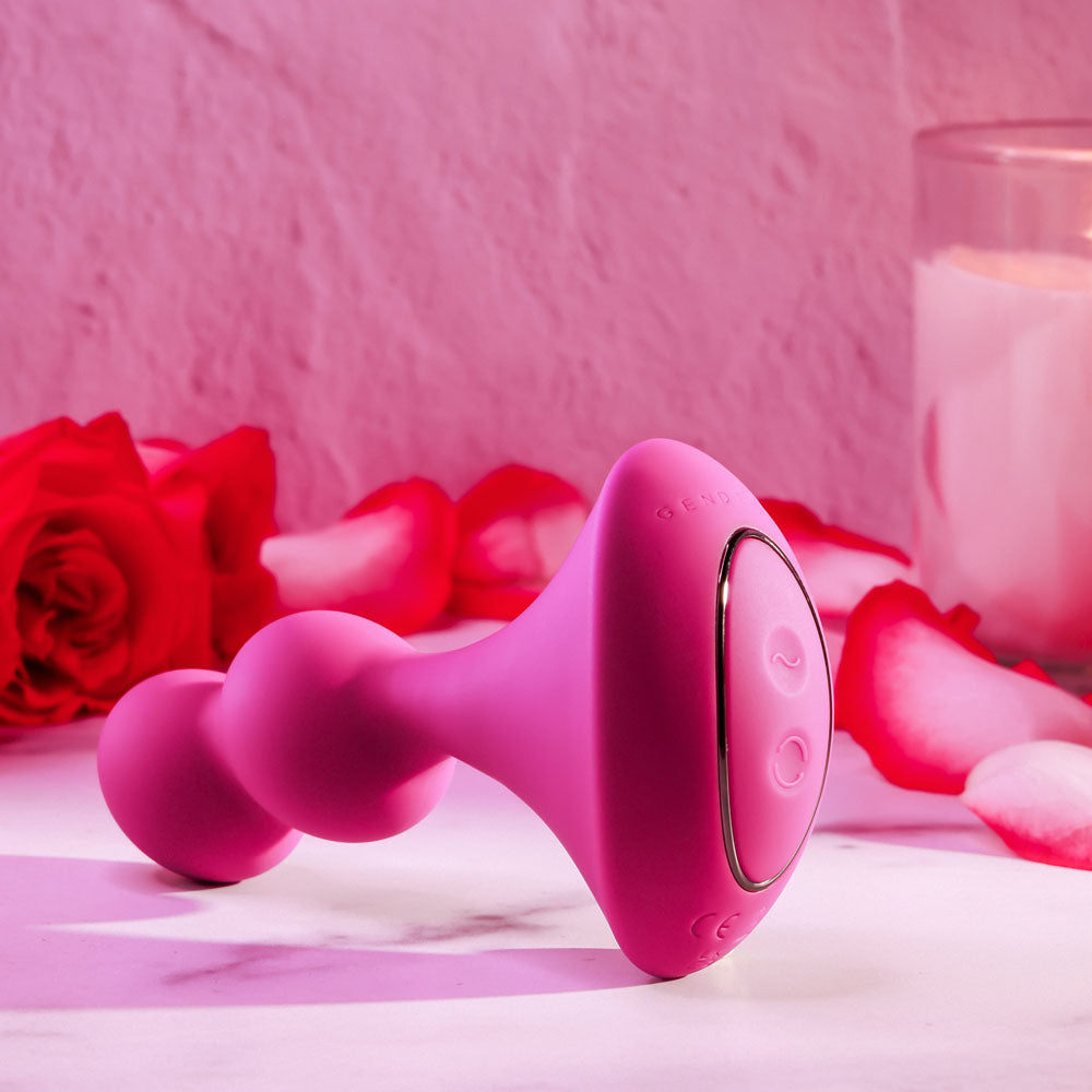Gender X BALL GAME -  13.5 cm USB Rechargeable Vibrating Butt Plug surrounded by rose petals.