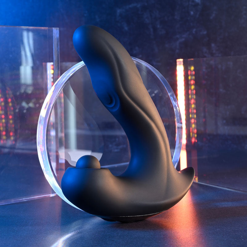 Gender X MAD TAPPER -  USB Rechargeable Double Tapping Vibrating Massager on display with glowing elements.