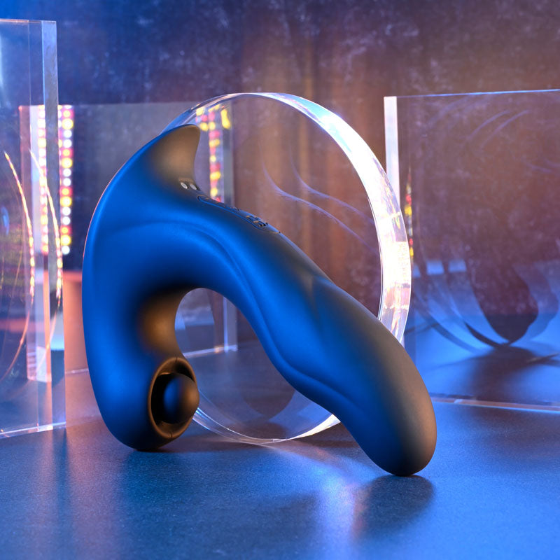 Gender X MAD TAPPER -  USB Rechargeable Double Tapping Vibrating Massager on a modern display with colorful background.