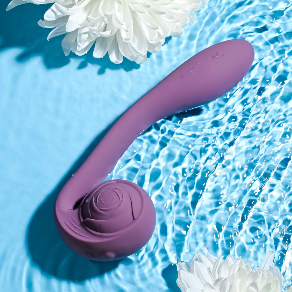 Gender X POSEABLE YOU -  USB Rechargeable Poseable Vibrator in water with lotus flowers.