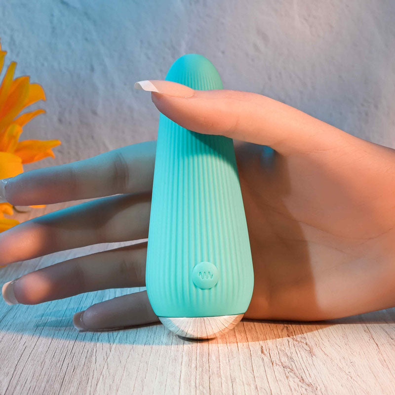 Gender X O-CONE - 10.8 cm (4.25'') USB Rechargeable Bullet in a hand, showcasing its ribbed design and chrome base.