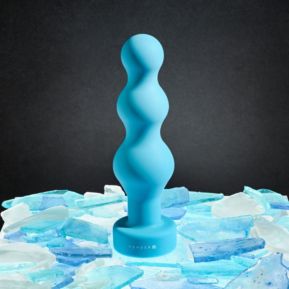 Gender X PLUGGED UP -  13.6 cm USB Rechargeable Butt Plug on a bed of ice-like stones, showcasing its beaded design.
