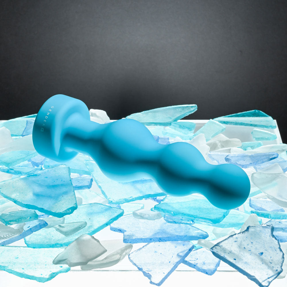 Gender X PLUGGED UP - 13.6 cm USB Rechargeable Butt Plug on a bed of ice shards, showcasing its sleek design.