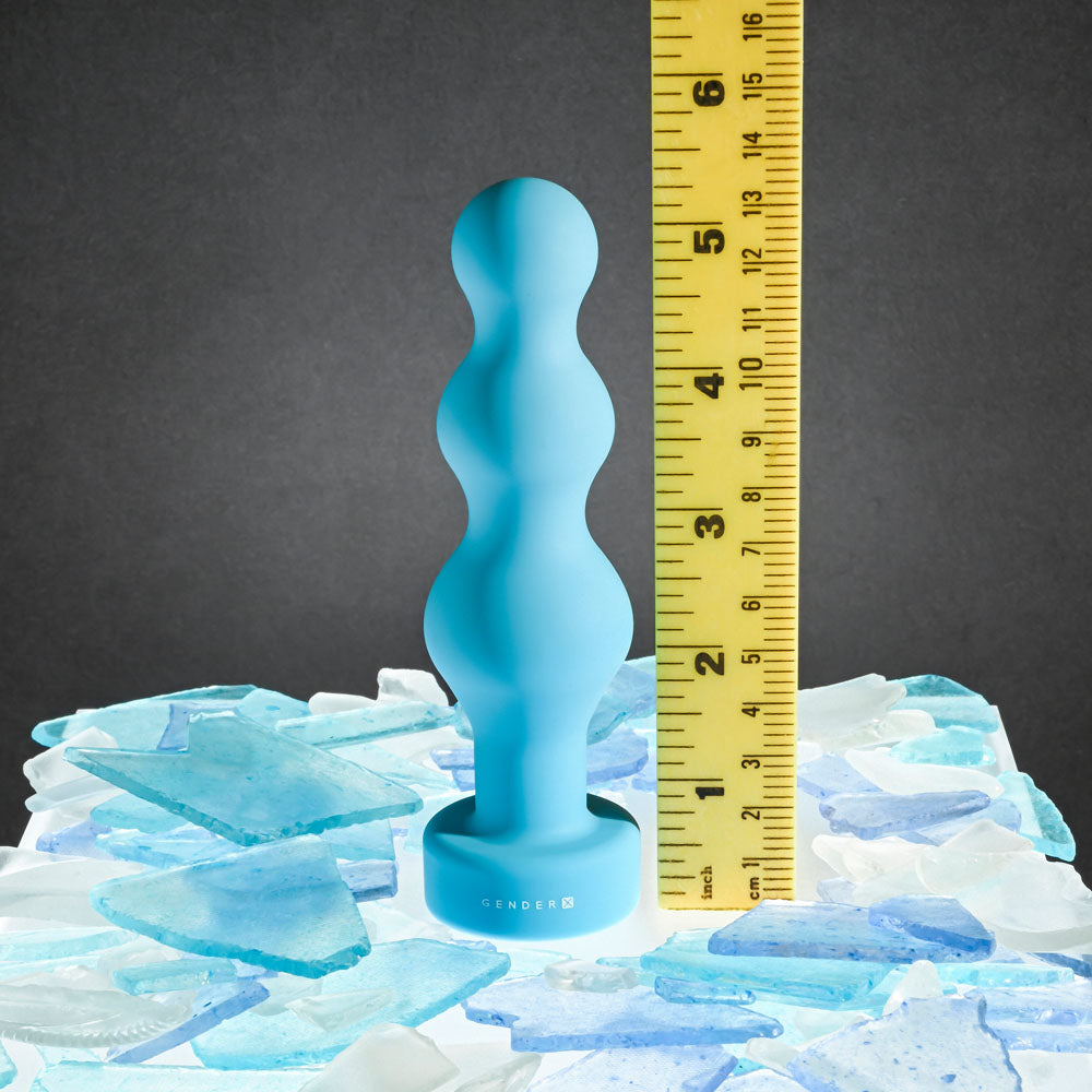 Gender X PLUGGED UP -  13.6 cm USB Rechargeable Butt Plug on ice with a ruler for size reference.