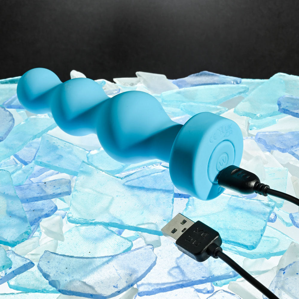 Gender X PLUGGED UP - 13.6 cm USB Rechargeable Butt Plug on ice with charging cable.