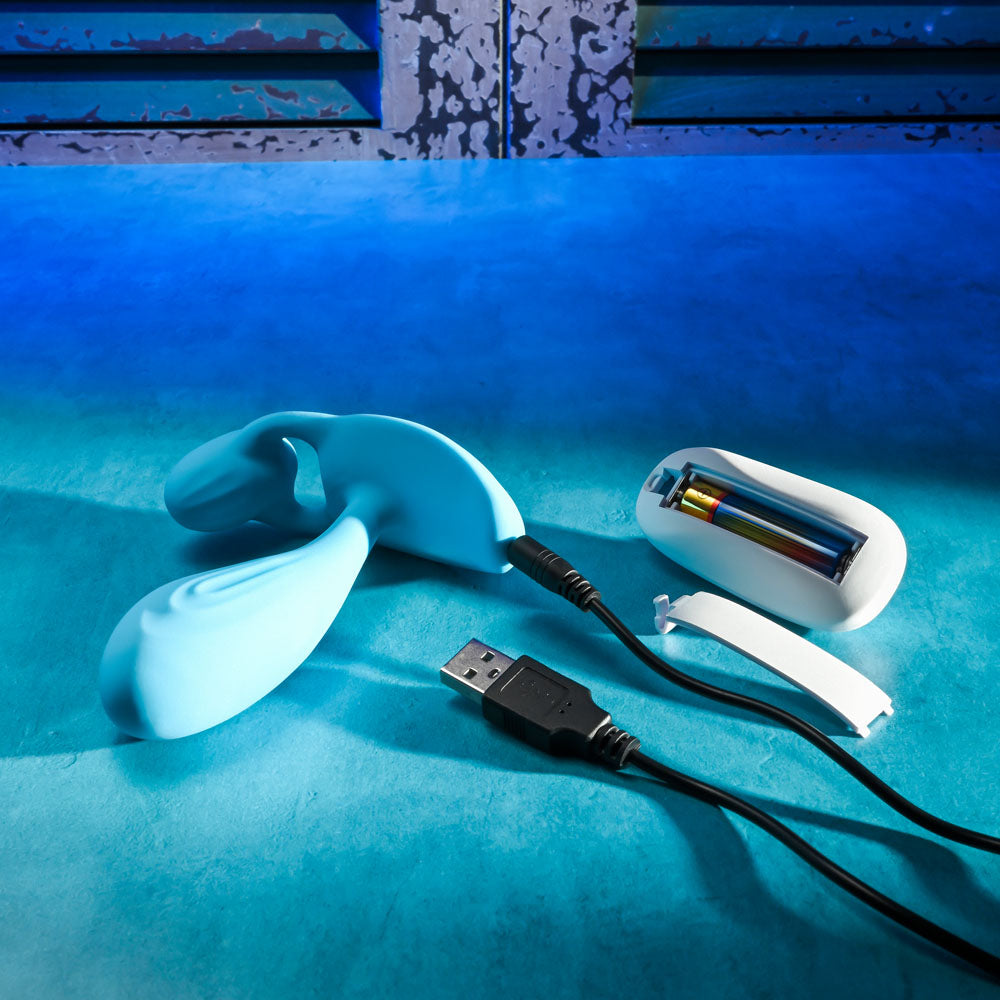 Gender X WEAR ME OUT -  11.1 cm USB Rechargeable Wearable Vibrator with Wireless Remote on a colorful surface with charging cable.
