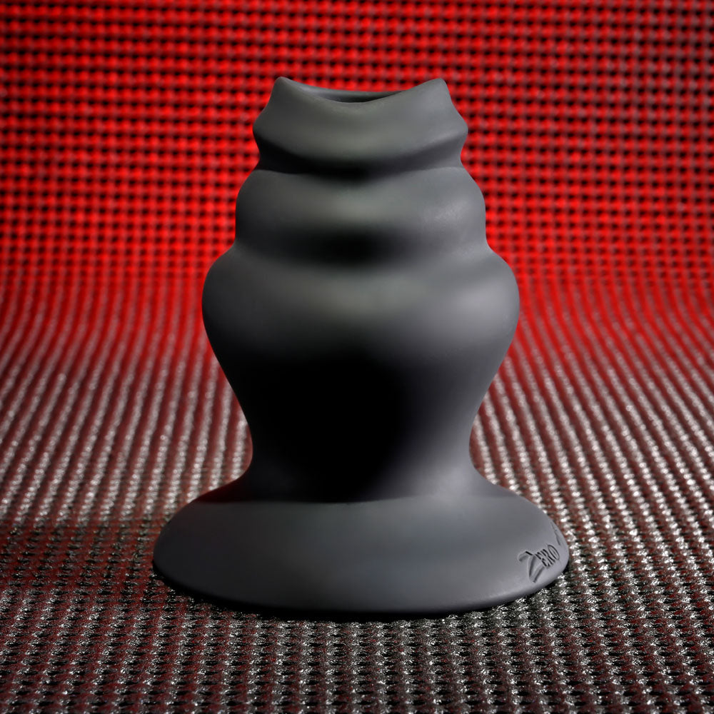 Gender X ECHO - 15.3 cm USB Rechargeable Butt Plug on a textured background, showcasing its sleek design.