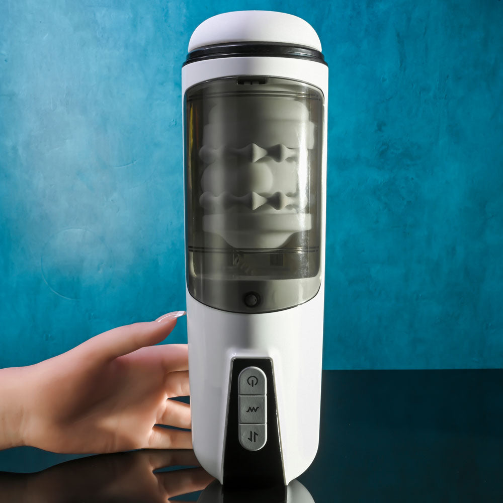 Gender X GET YOUR STROKE ON - USB Rechargeable Thrusting & Vibrating Auto Masturbator on display