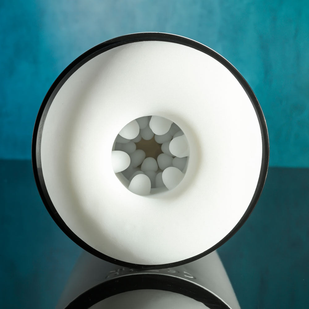 Gender X GET YOUR STROKE ON - USB Rechargeable Thrusting & Vibrating Auto Masturbator opening showcasing its interior design.