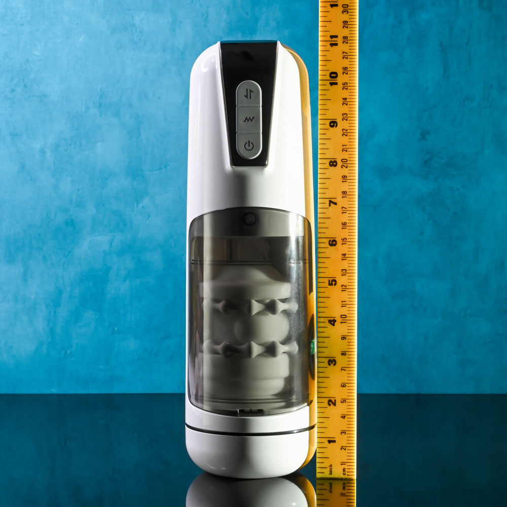 Gender X GET YOUR STROKE ON - USB Rechargeable Thrusting & Vibrating Auto Masturbator displayed with ruler for size comparison.