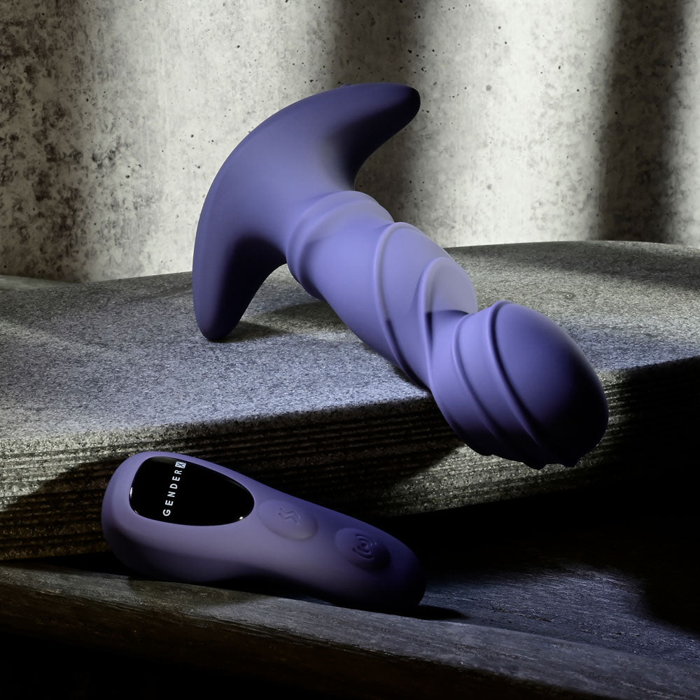 USB rechargeable vibrator with remote, featuring textured design and ergonomic remote control on a sleek surface.