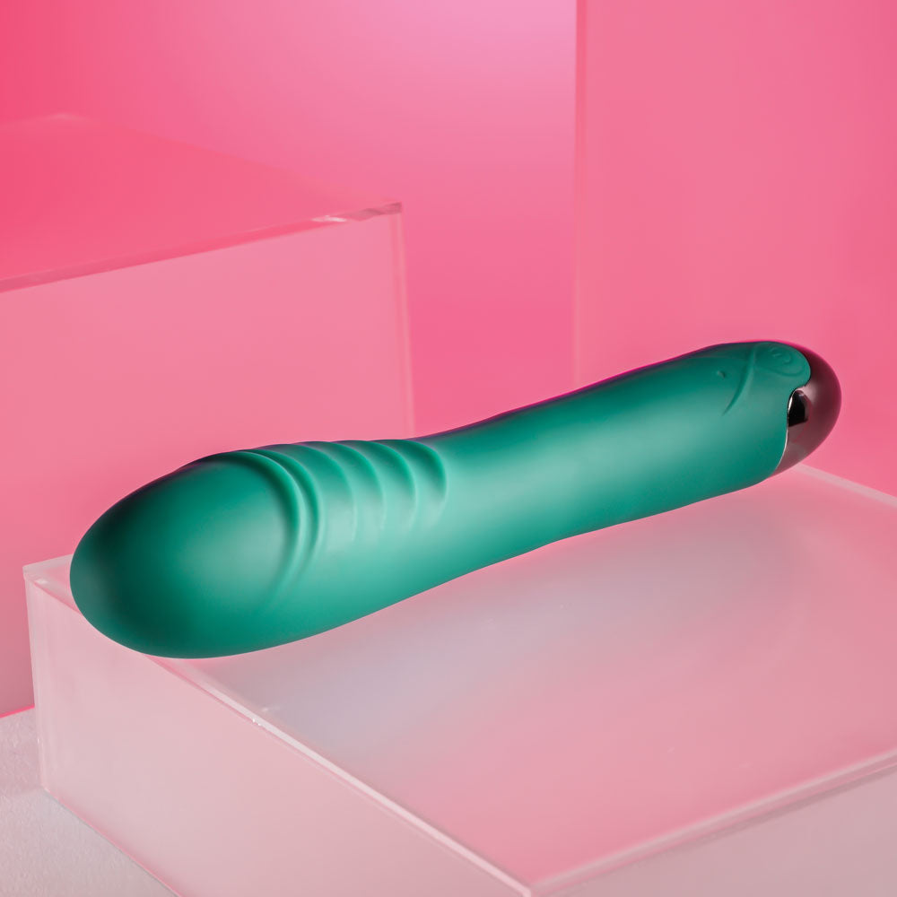 Gender X PIROUETTE - 20.6 cm USB Rechargeable Vibrator displayed on clear blocks.