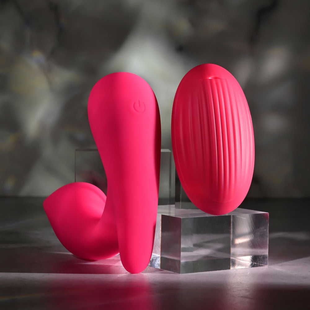 Gender X ALL ABOUT THE BASS -  USB Rechargeable Wearable Vibrator with Wireless Remote in pink on display.