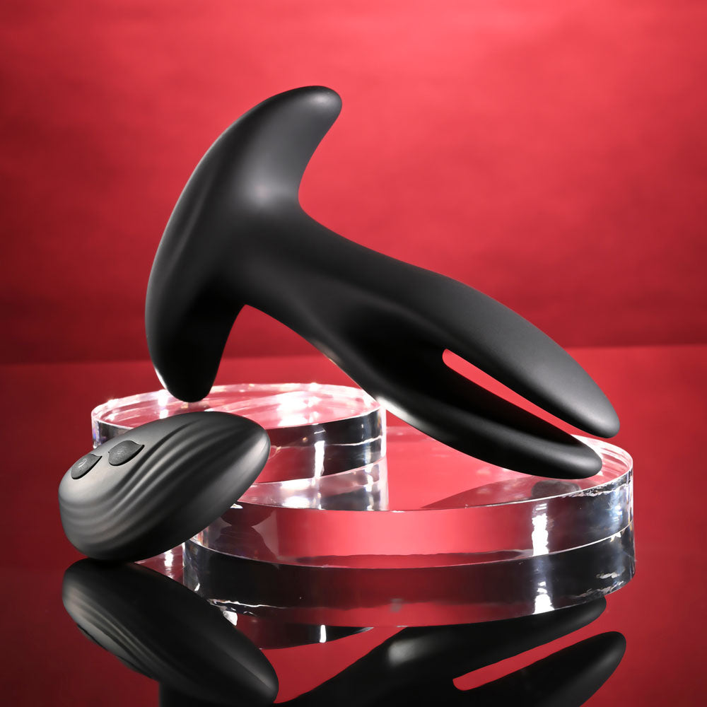 Gender X SPREAD THE LOVE -  USB Rechargeable Stretching Anal Plug with Wireless Remote on a sleek display.