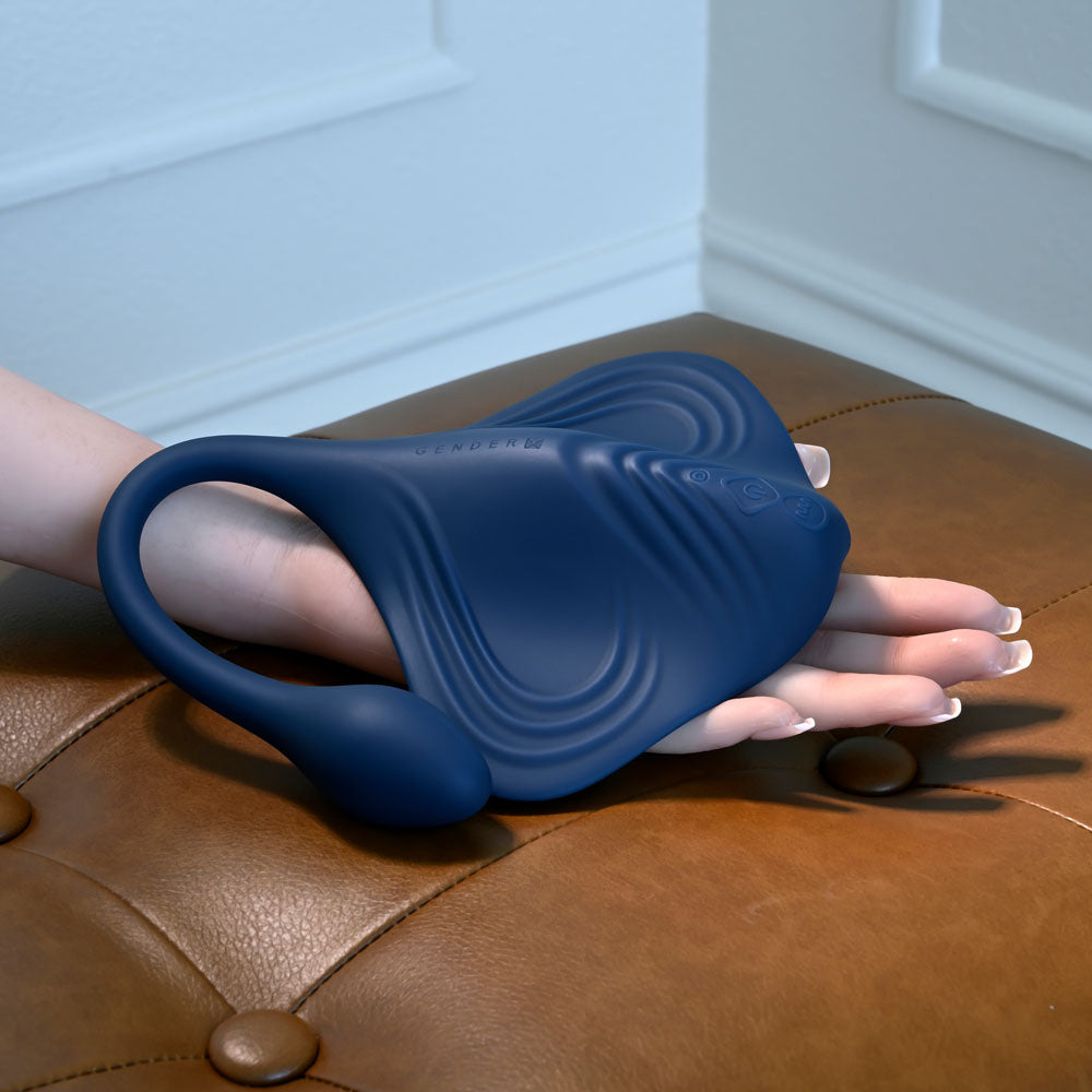 Gender X DAILY GRIND -  USB Rechargeable Grinding Pad with Anal Plug on a hand, showcasing its ergonomic design.