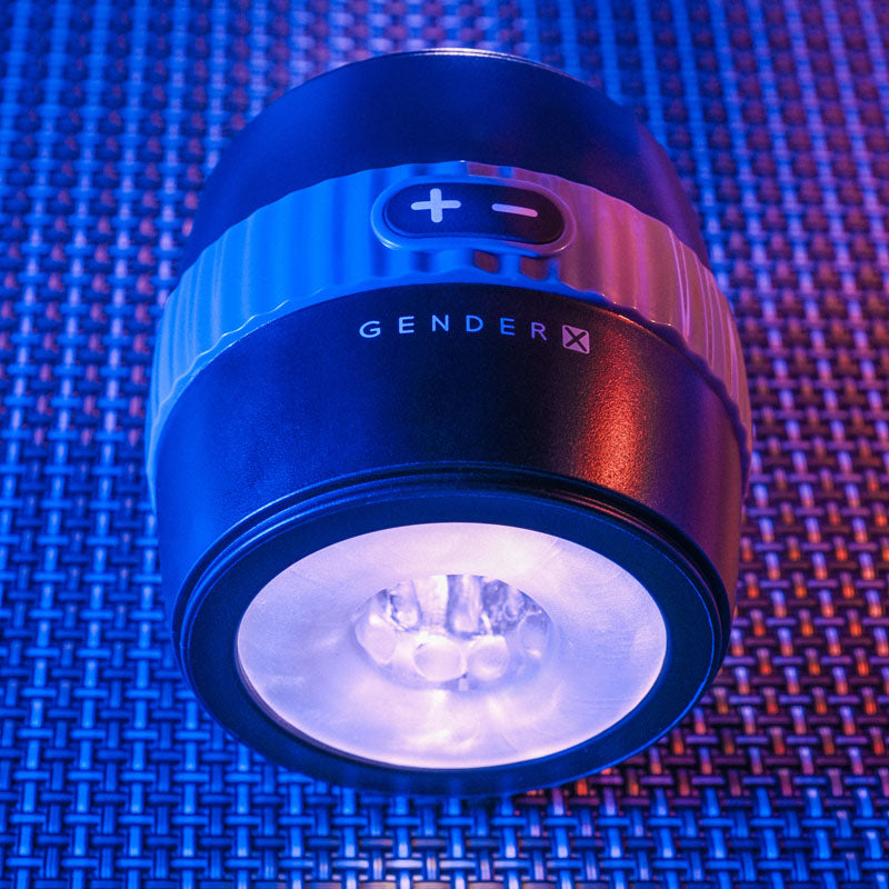Gender X BARREL OF FUN - USB Rechargeable Stroker device with LED light in blue and black design on textured surface.
