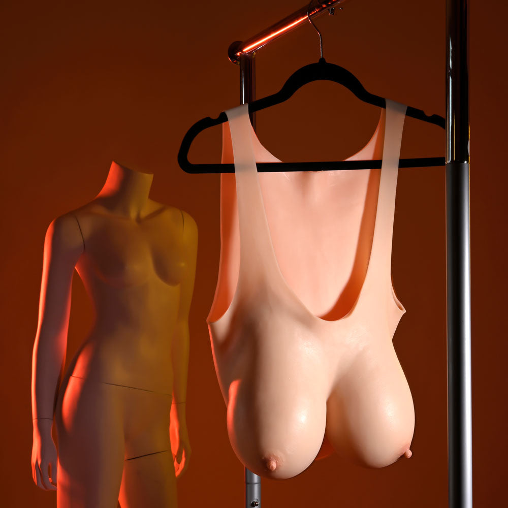 Gender X UNDERGARMENTS - PLATE E-CUP - Light - Wearable Breasts - E-Cup Size displayed on a mannequin hanger.