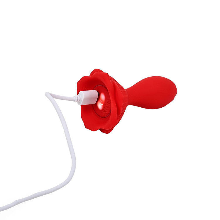 Adam & Eve THE ROSEBUD -  10.2 cm USB Rechargeable Vibrating Butt Plug with Remote charging with a red flower design.