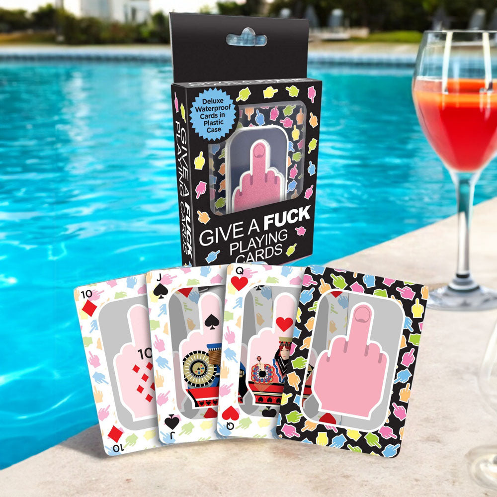 Give A Fuck Playing Cards - Waterproof Novelty Playing Cards displayed by a pool with a cocktail.
