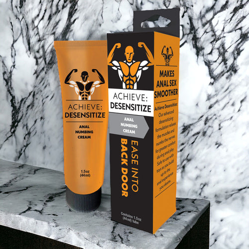 Achieve Desensitizing Cream 44 ml tube and packaging for anal desensitizing cream on marble surface.
