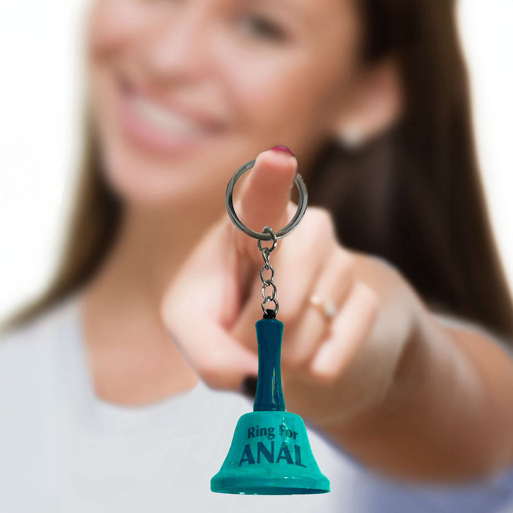 Super Fun Key Chain - Ring For Anal - Novelty Bell Keychain held by a smiling woman, adding humor to any keyring.