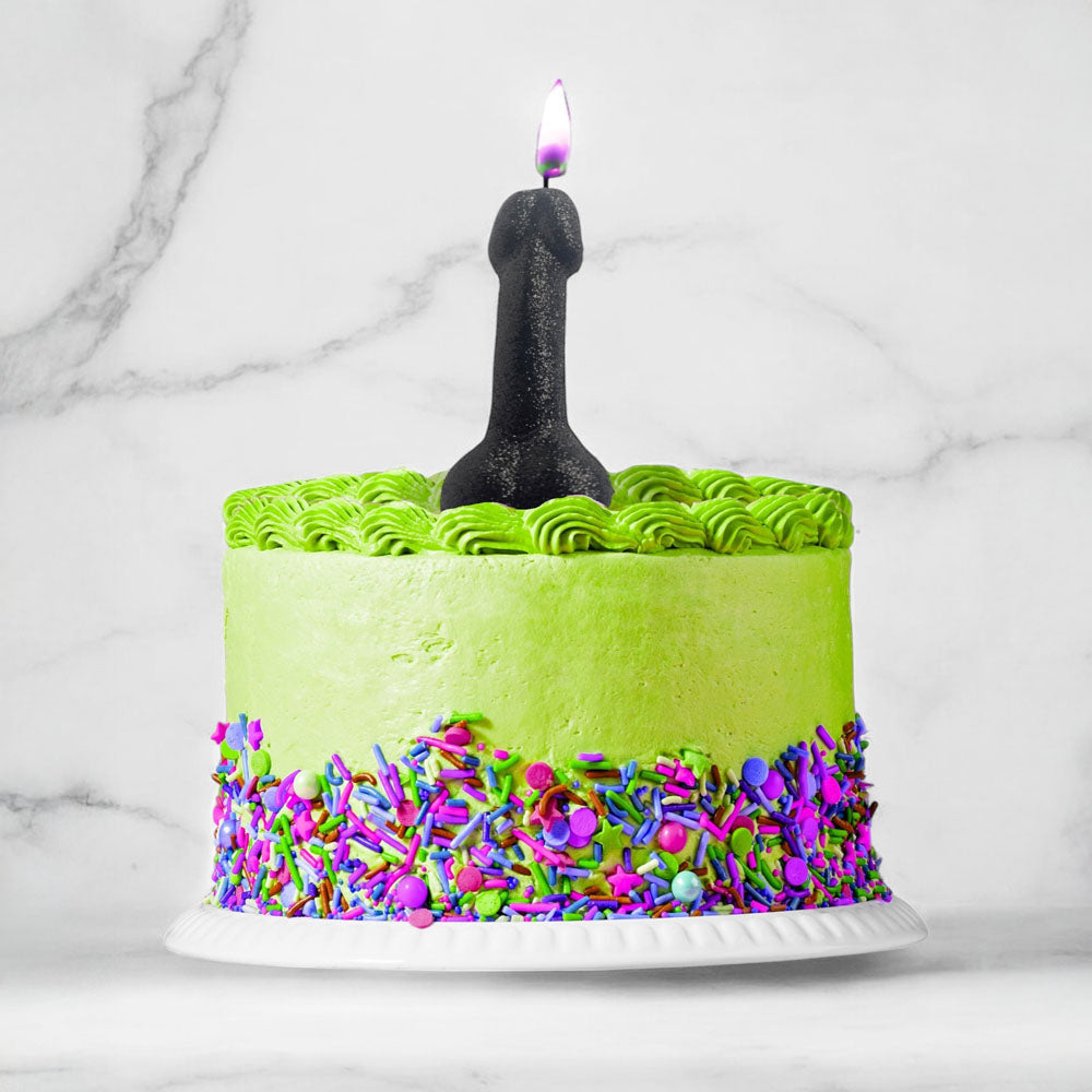 Glitterati Glitter Penis Candle - 10 cm Penis Party Candle atop a green cake with colorful sprinkles.
