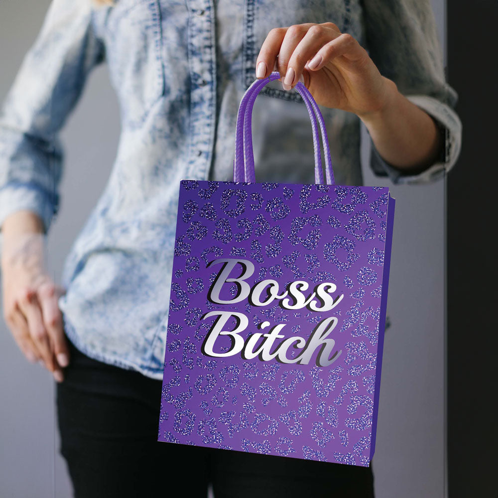 Boss Bitch Gift Bag - Novelty Gift Bag held by a person showcasing its stylish purple design and elegant handles.