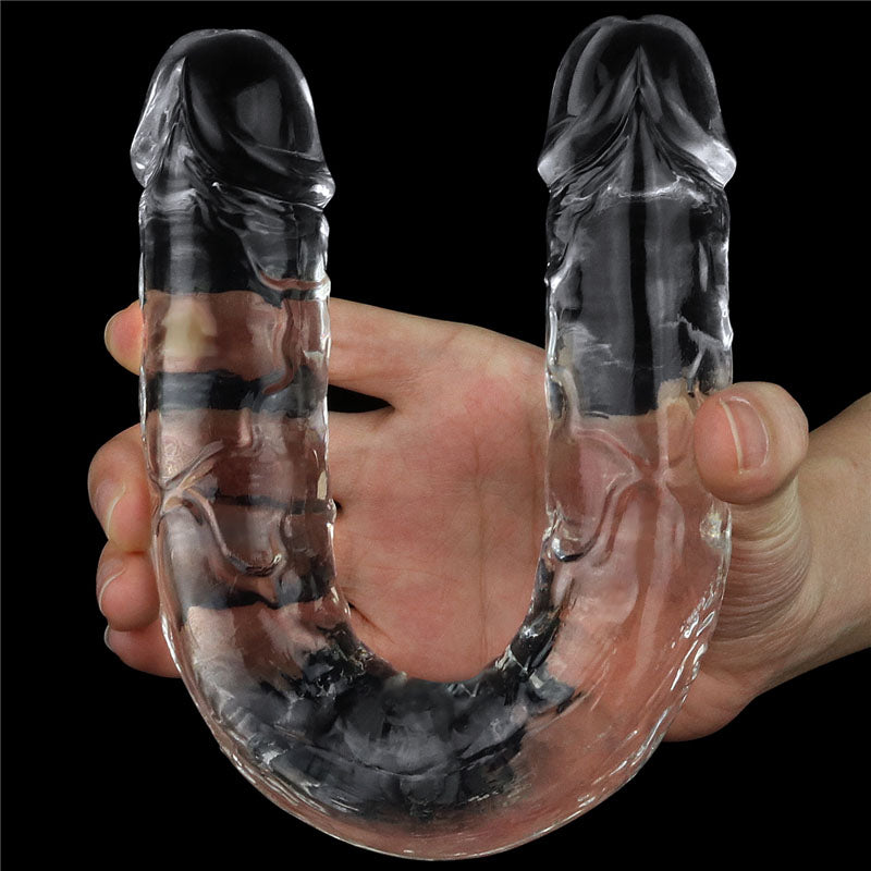 Flawless  Double Dildo 12'' -  30 cm Double Dong held in hand, showcasing its transparent design and realistic details.