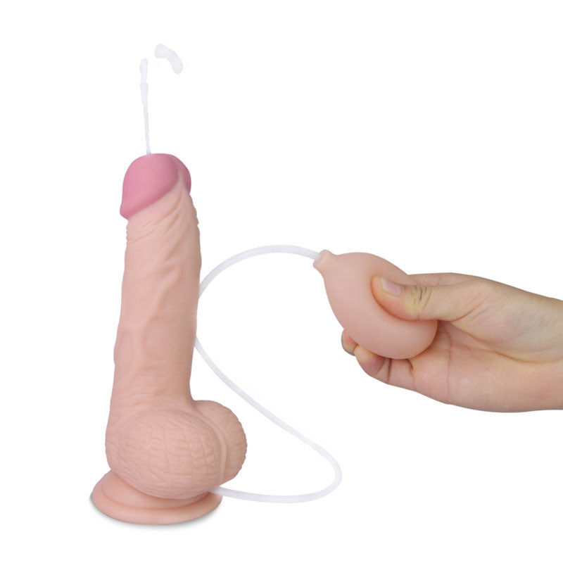 Squirting dildo with realistic design featuring bulbous head and textured shaft for enhanced sensations.