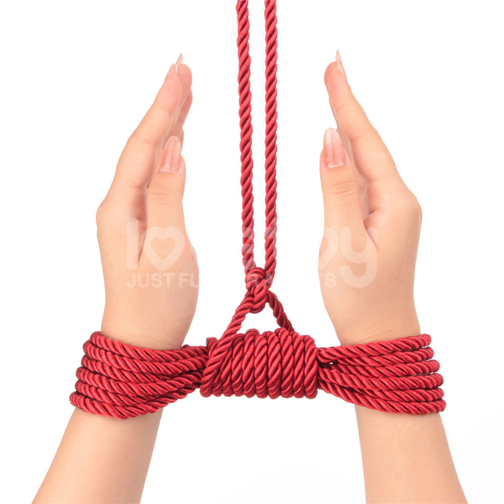 Rebellion Reign Silky Bondage Rope -  -  Bondage Rope - 10 metre length, demonstrating secure and sensual ties on hands.