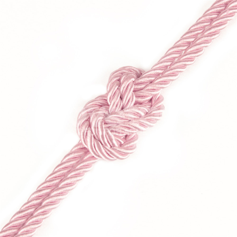 Close-up of Rebellion Reign Silky Bondage Rope - Bondage Rope - 10 metre length with a decorative knot.