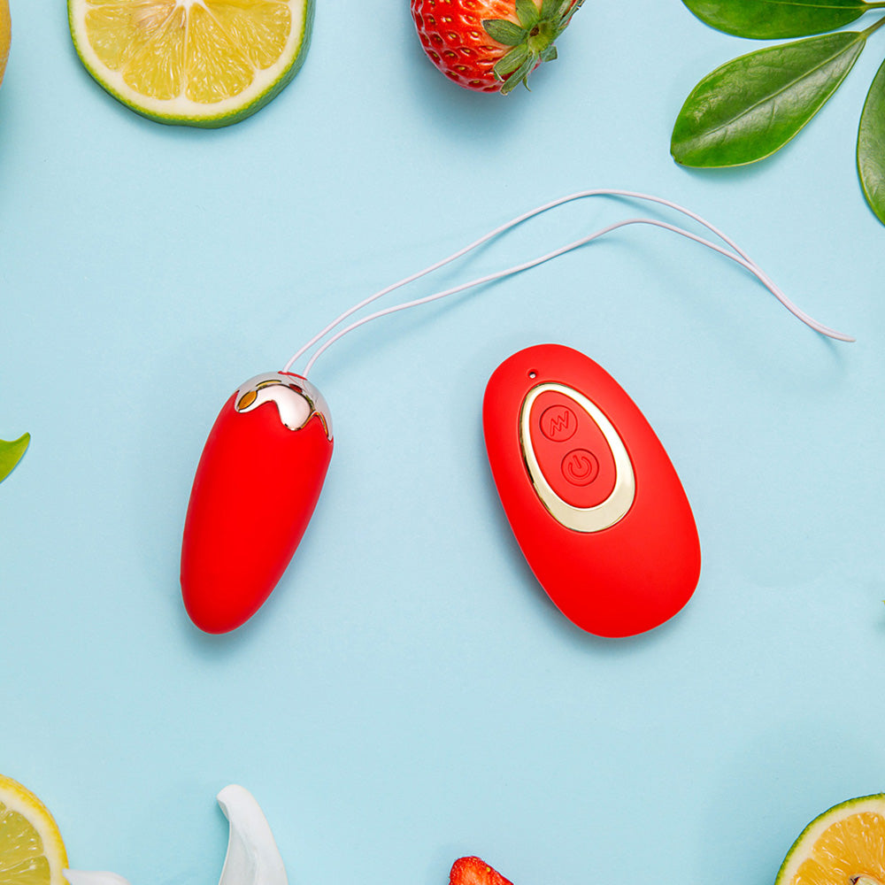 Maia SHORTCAKE - USB Rechargeable Vibrating Egg with Wireless Remote on a colorful fruit background.