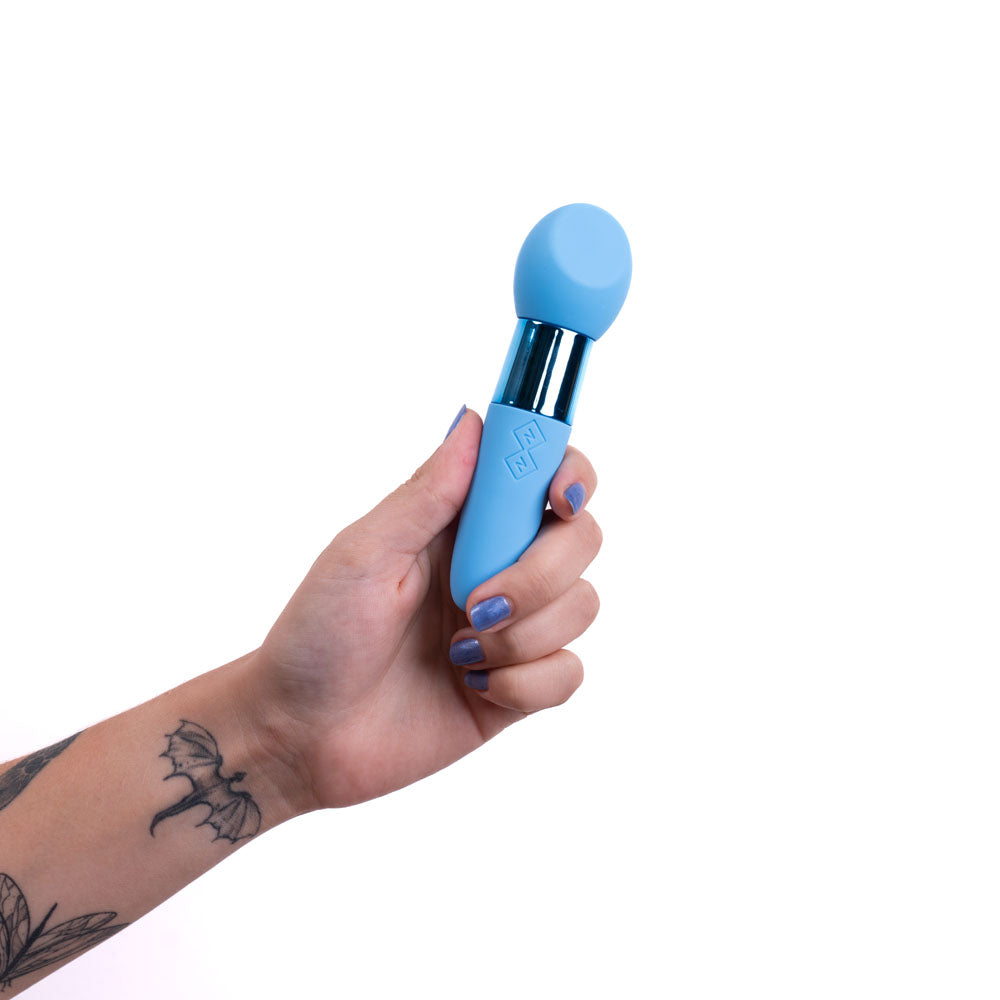Maia RINA -  -  13.3 cm USB Rechargeable Vibrator held in hand, showcasing soft silicone and sleek design.