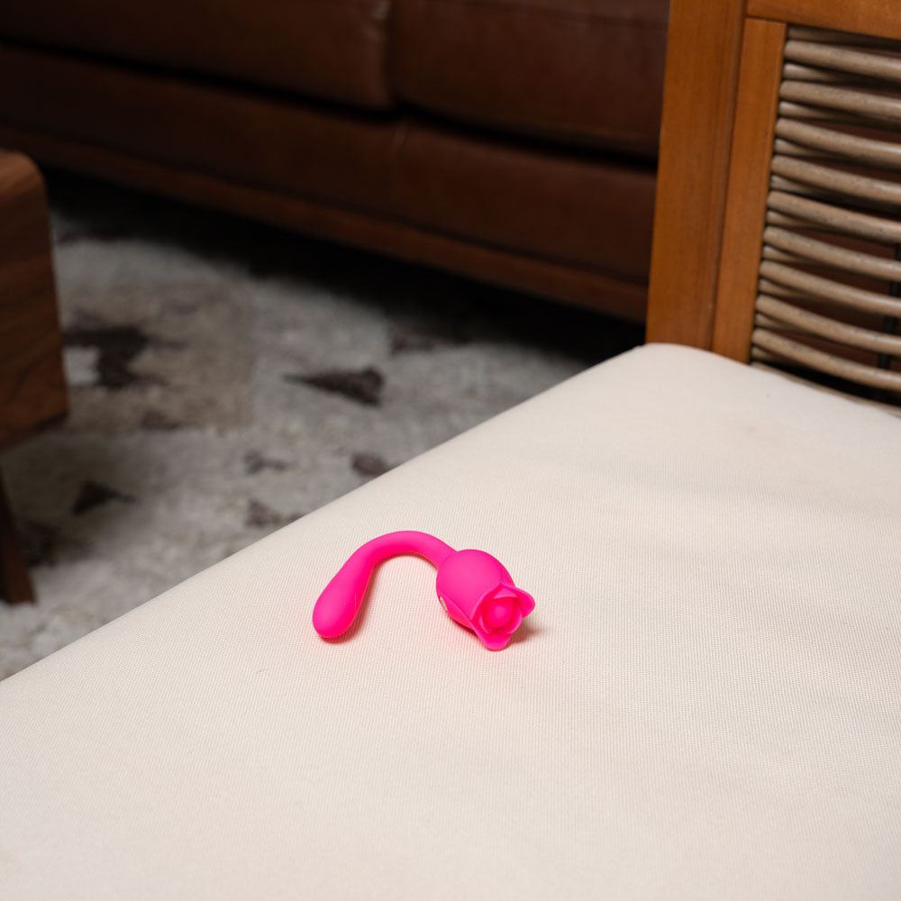 Maia MEADOW - 14 cm USB Rechargeable Flower Stimulator on a couch, designed for intimate essentials for her.