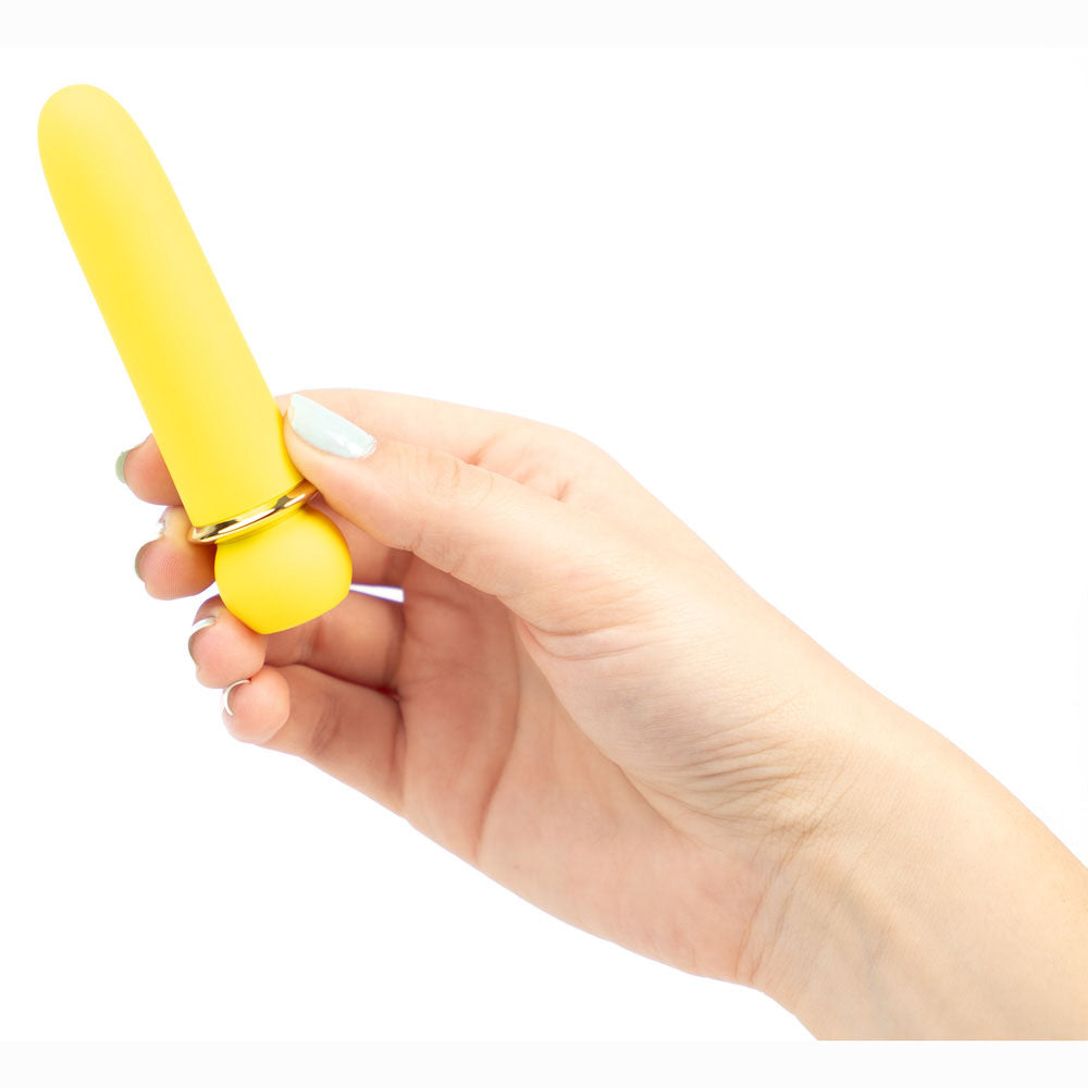 Maia JAGUAR -  -  10.1 cm USB Rechargeable Bullet held in hand, showcasing its sleek yellow design.